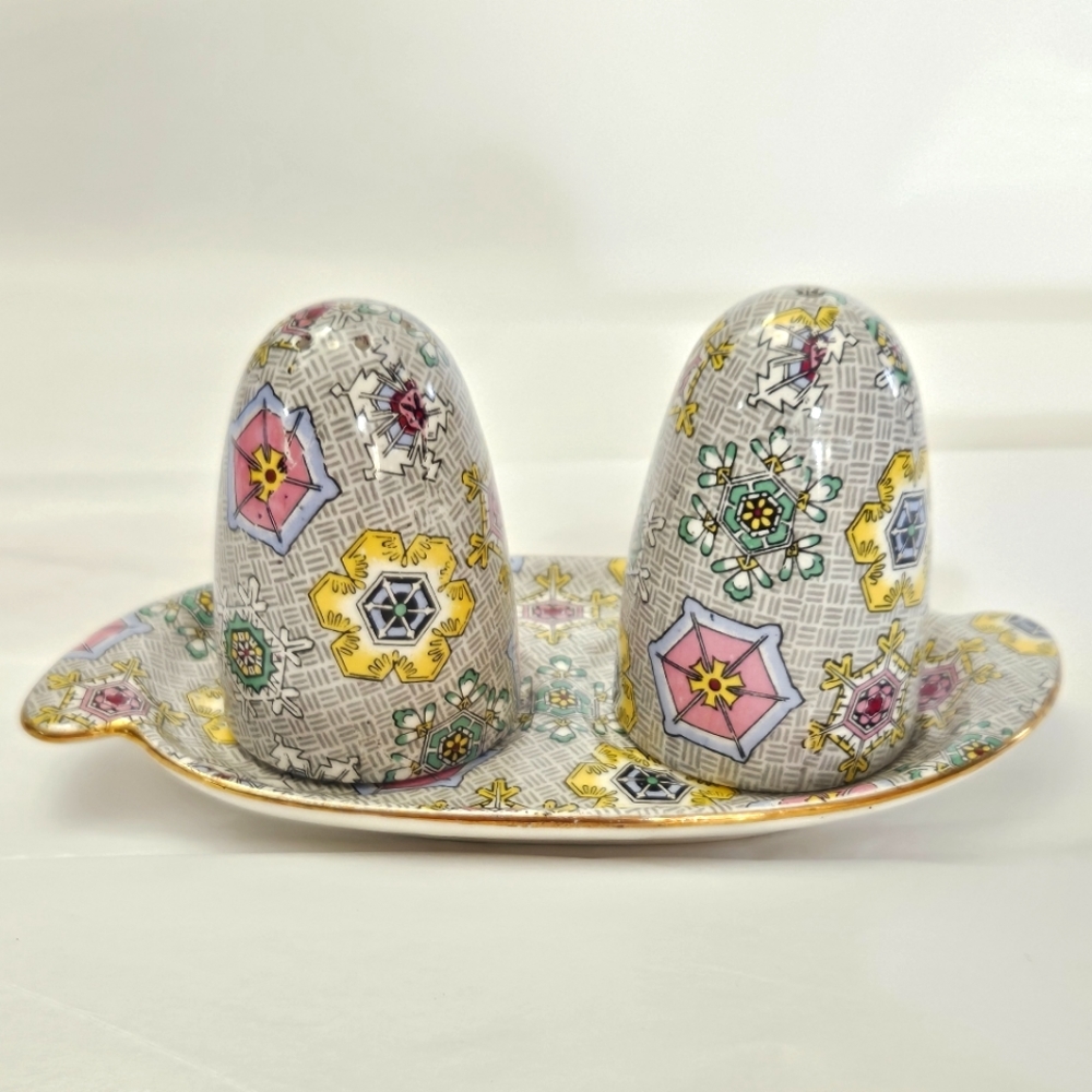 "Kaleidoscope" chintz pattern, salt, and pepper with tray.